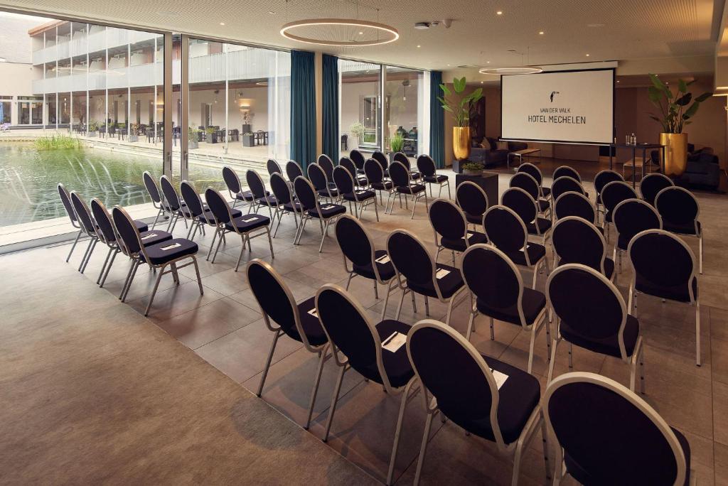 Conference room with daylight and views of the water at Van der Valk Hotel Mechelen